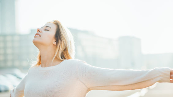 Half length of young beautiful cacuasian woman feeling free with